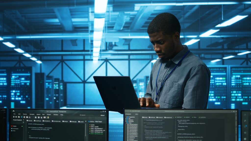 Manager in server hub using laptop to find errors affecting performance